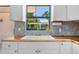 Kitchen featuring a sink with a view of the pergola covered patio area at 4530 Catalonia S Way, St Petersburg, FL 33712