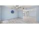 Open-concept living room flows into the kitchen, offering modern flooring, neutral paint, and bright lighting at 4530 Catalonia S Way, St Petersburg, FL 33712