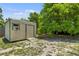 A backyard shed offers convenient storage, complemented by a well-maintained lawn at 4530 Catalonia S Way, St Petersburg, FL 33712