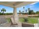 Private balcony offering views of lush landscaping and a tranquil pond at 4607 Los Robles Ct, Palmetto, FL 34221