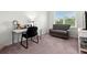 Bedroom featuring a desk, sofa, and comfortable work space at 4607 Los Robles Ct, Palmetto, FL 34221