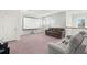 Upstairs media room with projector screen, large sofa, and comfortable seating at 4607 Los Robles Ct, Palmetto, FL 34221