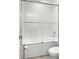 Bathroom shower with sliding glass doors and tiled walls at 4607 Los Robles Ct, Palmetto, FL 34221