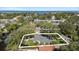 Beautiful aerial view of the property featuring lush landscaping and a well-maintained yard near the water at 4722 W Laurel Rd, Tampa, FL 33629