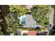 An aerial view showcases the pool, patio, and landscaping of this lovely home at 4722 W Laurel Rd, Tampa, FL 33629