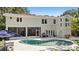 A stunning backyard featuring a beautiful pool, patio area, and lush landscaping at 4722 W Laurel Rd, Tampa, FL 33629