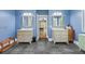 Bright bathroom with dual vanities, tiled floor, and a neutral color palette at 4722 W Laurel Rd, Tampa, FL 33629