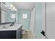 Bathroom featuring a single sink vanity with a white marble countertop and modern fixtures at 4722 W Laurel Rd, Tampa, FL 33629