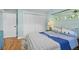 Cozy bedroom featuring natural light, a closet, and stylish decor at 4722 W Laurel Rd, Tampa, FL 33629