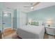 Cozy bedroom featuring white accents, hardwood floors, and a comfortable setting for relaxation at 4722 W Laurel Rd, Tampa, FL 33629