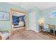 A blue bedroom includes a connecting sitting room or office area, plus a neutral color scheme and decor at 4722 W Laurel Rd, Tampa, FL 33629