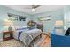 Bedroom with a plush bed, side tables, and a light blue dresser at 4722 W Laurel Rd, Tampa, FL 33629