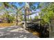 Boat lift with boat, waterfront, and dock views at 4722 W Laurel Rd, Tampa, FL 33629