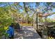 Dock with chairs, boat lift, and picturesque waterfront setting at 4722 W Laurel Rd, Tampa, FL 33629