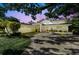 Stunning home with manicured lawn, paver driveway, attached garage, and inviting covered front entrance at 4722 W Laurel Rd, Tampa, FL 33629