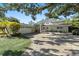 Stunning home with manicured lawn, paver driveway, attached garage, and inviting covered front entrance at 4722 W Laurel Rd, Tampa, FL 33629