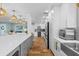 Bright, open kitchen with long center island, pendant lighting, and stainless appliances at 4722 W Laurel Rd, Tampa, FL 33629