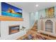 Living room boasts a fireplace, hardwood floors, and an adjacent staircase at 4722 W Laurel Rd, Tampa, FL 33629