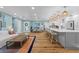 Open-concept living space with kitchen, dining, and living room with hardwood floors at 4722 W Laurel Rd, Tampa, FL 33629