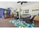 Inviting covered patio featuring comfortable seating, dining area, and ceiling fans at 4722 W Laurel Rd, Tampa, FL 33629