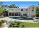 Beautiful backyard pool with patio, lawn, and spacious home exterior at 4722 W Laurel Rd, Tampa, FL 33629