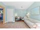 A serene sitting room offers ample space for relaxation, accentuated by tranquil wall colors and comfortable seating at 4722 W Laurel Rd, Tampa, FL 33629