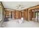 Unfinished bathroom with wood framing, ceiling fan and toilet fixture at 5107 W Azeele St, Tampa, FL 33609