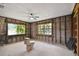 Unfinished bathroom with framing, multiple windows and toilet fixture at 5107 W Azeele St, Tampa, FL 33609