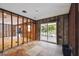 Bedroom ready for renovation with sliding glass door leading to the exterior at 5107 W Azeele St, Tampa, FL 33609