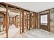 Interior view of home in progress featuring wood framing and light floors at 5107 W Azeele St, Tampa, FL 33609