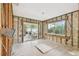 Interior view with wood framing, large windows, and sliding glass door at 5107 W Azeele St, Tampa, FL 33609