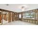 Open-concept living room features exposed framing, abundant natural light, and an open floor plan at 5107 W Azeele St, Tampa, FL 33609