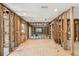 Bright and airy living room with new flooring and exposed framing, providing endless renovation possibilities at 5107 W Azeele St, Tampa, FL 33609