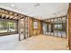 Spacious living room with new flooring and exposed framing, offering a blank canvas for customization at 5107 W Azeele St, Tampa, FL 33609