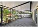Relaxing screened-in patio with plenty of space for entertaining and lush backyard views at 5107 W Azeele St, Tampa, FL 33609