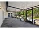 Relaxing screened-in patio with plenty of space for entertaining and lush backyard views at 5107 W Azeele St, Tampa, FL 33609