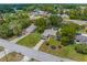 Aerial view of a home with a detached garage and landscaped yard at 5112 Odin St, Spring Hill, FL 34608