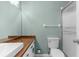 Bathroom features a vanity with wood counter, modern fixtures, and a glass shower enclosure at 5112 Odin St, Spring Hill, FL 34608