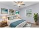 Bright bedroom featuring large windows, side tables, and a comfortable bed with plenty of pillows at 5112 Odin St, Spring Hill, FL 34608