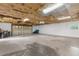 A spacious garage features a modern door, natural light, and ample space at 5112 Odin St, Spring Hill, FL 34608