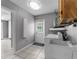 Laundry room includes washer, dryer, utility sink, and convenient access to the backyard at 5112 Odin St, Spring Hill, FL 34608