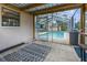 Covered patio leading to screened pool with brick-paver decking at 5112 Odin St, Spring Hill, FL 34608