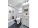 Elegant bathroom features a modern vanity, a sleek shower, and stylish black and white floor tiles at 5730 Imperial Ky, Tampa, FL 33615