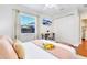 Bright bedroom has wooden floors, a desk, and modern furnishings for cozy and productive living at 5730 Imperial Ky, Tampa, FL 33615