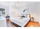 Relaxing bedroom with hardwood floors, a comfortable bed, and stylish lighting at 5730 Imperial Ky, Tampa, FL 33615