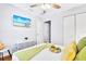 Inviting bedroom showcasing ample closet space, a mounted TV, and comfortable sleeping quarters at 5730 Imperial Ky, Tampa, FL 33615