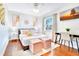 The well-lit bedroom features wooden floors, a ceiling fan, and a desk for a cozy workspace at 5730 Imperial Ky, Tampa, FL 33615