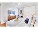 Cozy bedroom offers great closet space, a mounted TV, and a tranquil, inviting atmosphere at 5730 Imperial Ky, Tampa, FL 33615