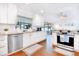 Bright, modern kitchen with white cabinetry, granite countertops, and stainless steel appliances at 5730 Imperial Ky, Tampa, FL 33615