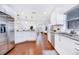Spacious kitchen with sleek stainless steel appliances, white cabinets, and granite countertops at 5730 Imperial Ky, Tampa, FL 33615